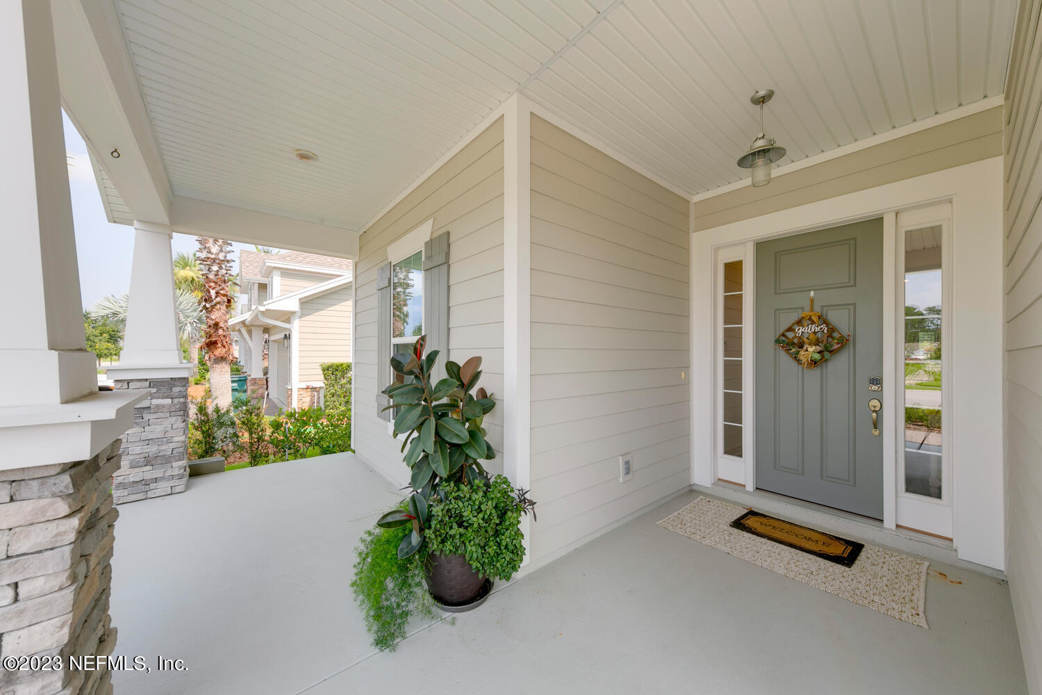 110 Pine Manor Drive Jacksonville, FL 32081 - Photo 4 of 55 a potted plant sitting in front of a house