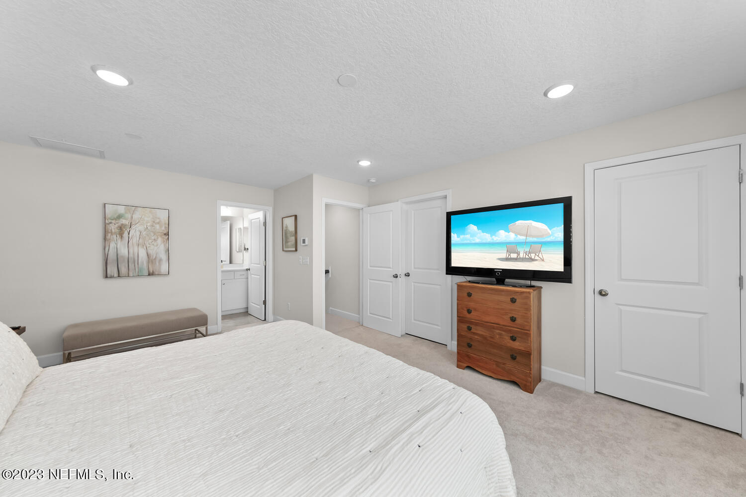 110 Pine Manor Drive Jacksonville, FL 32081 - Photo 43 of 55 a bedroom with a bed and a flat screen tv