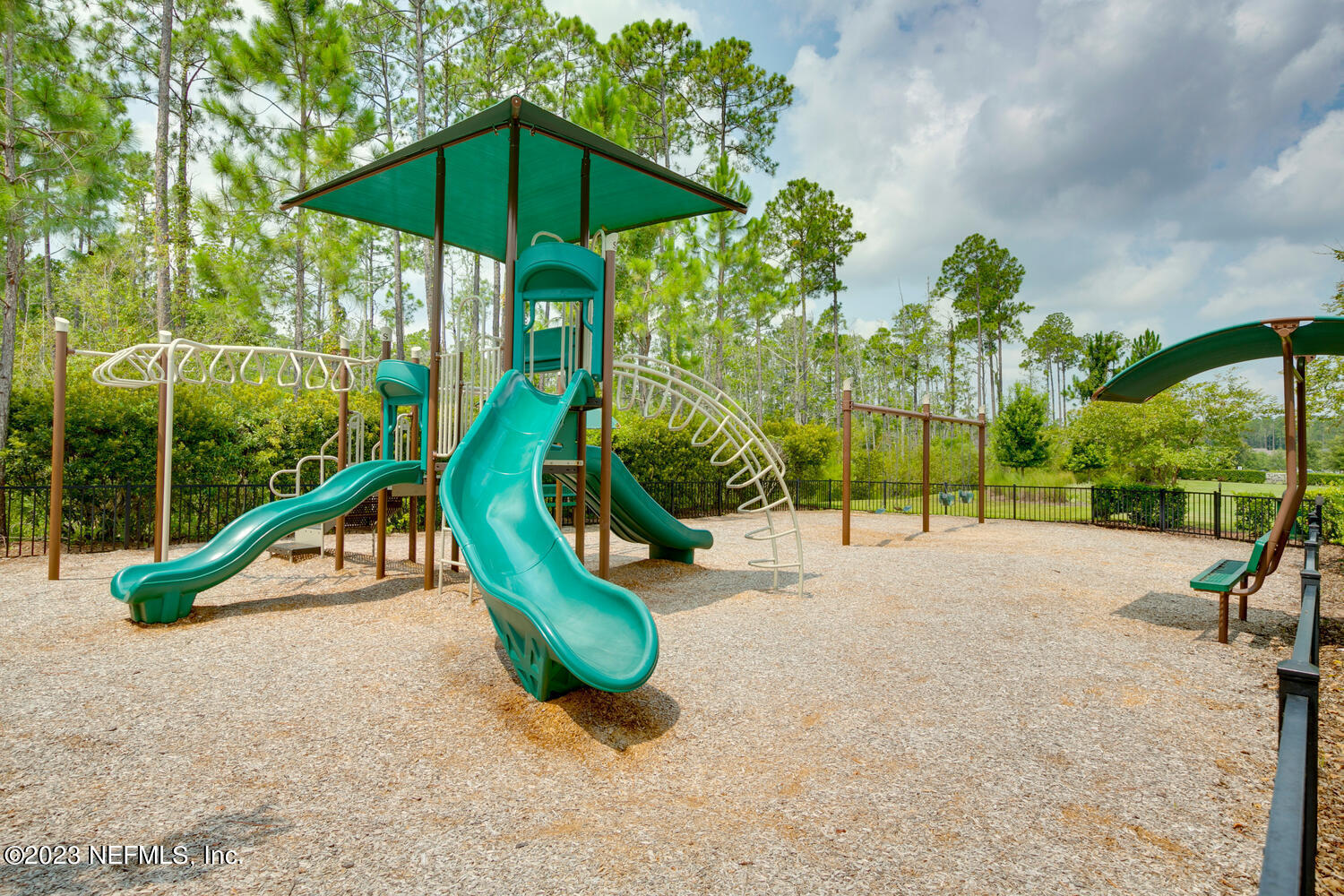 110 Pine Manor Drive Jacksonville, FL 32081 - Photo 46 of 55 a view of playground with a slide and swing