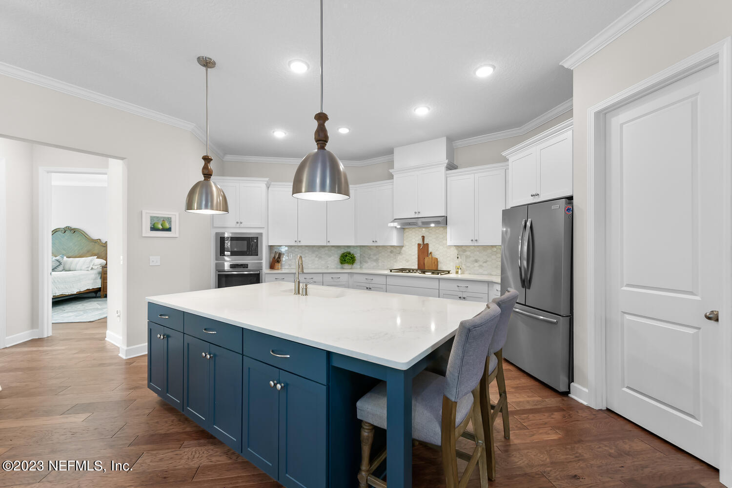 110 Pine Manor Drive Jacksonville, FL 32081 - Photo 9 of 55 a large kitchen with a table and refrigerator
