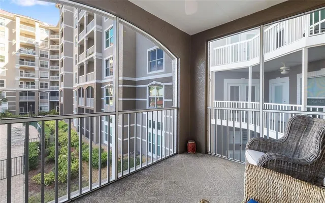 a view of a balcony with a floor to ceiling window