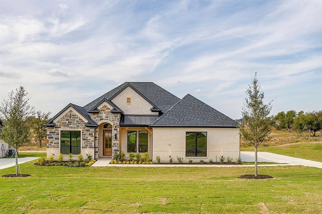 a front view of a house with a yard