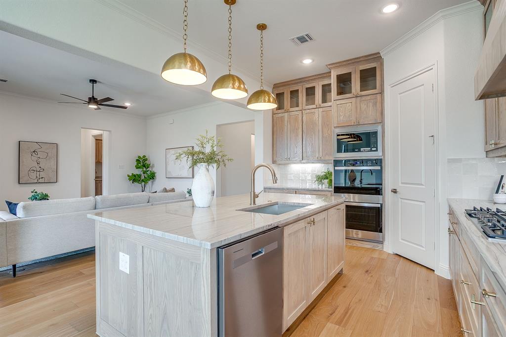 320 Slimp Bluff Azle, TX 76020 - Photo 15 of 37 a kitchen with a sink a counter space appliances and cabinets