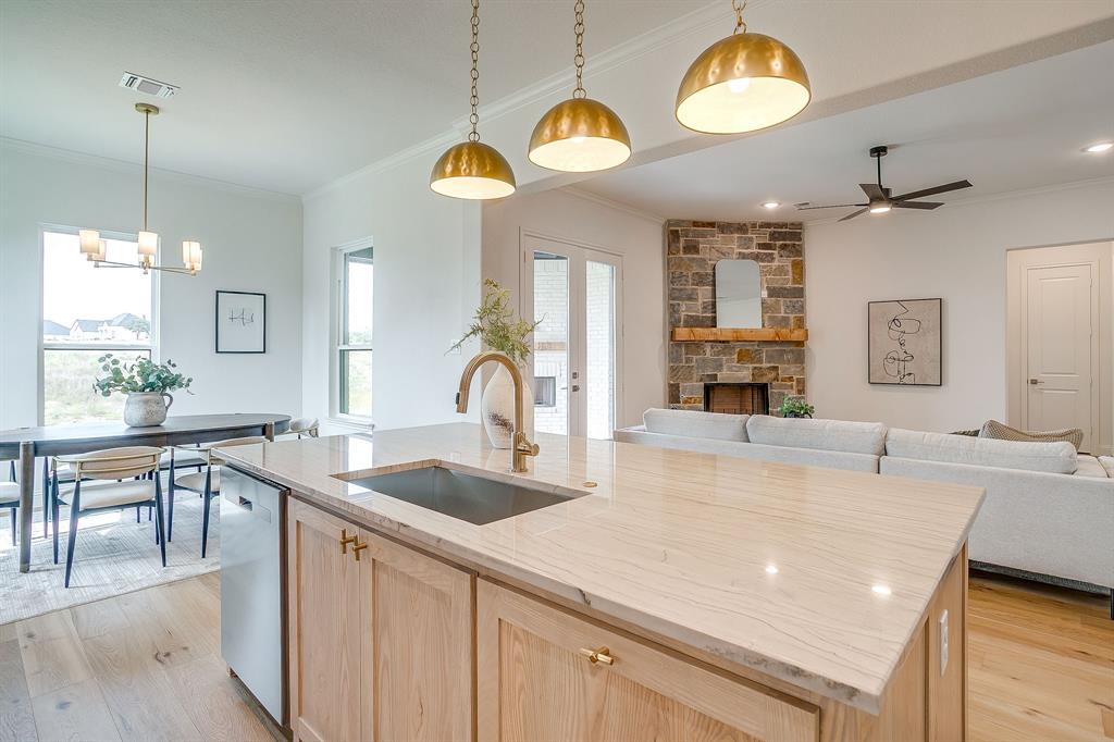 320 Slimp Bluff Azle, TX 76020 - Photo 16 of 37 a view of a kitchen counter space a sink and living room view