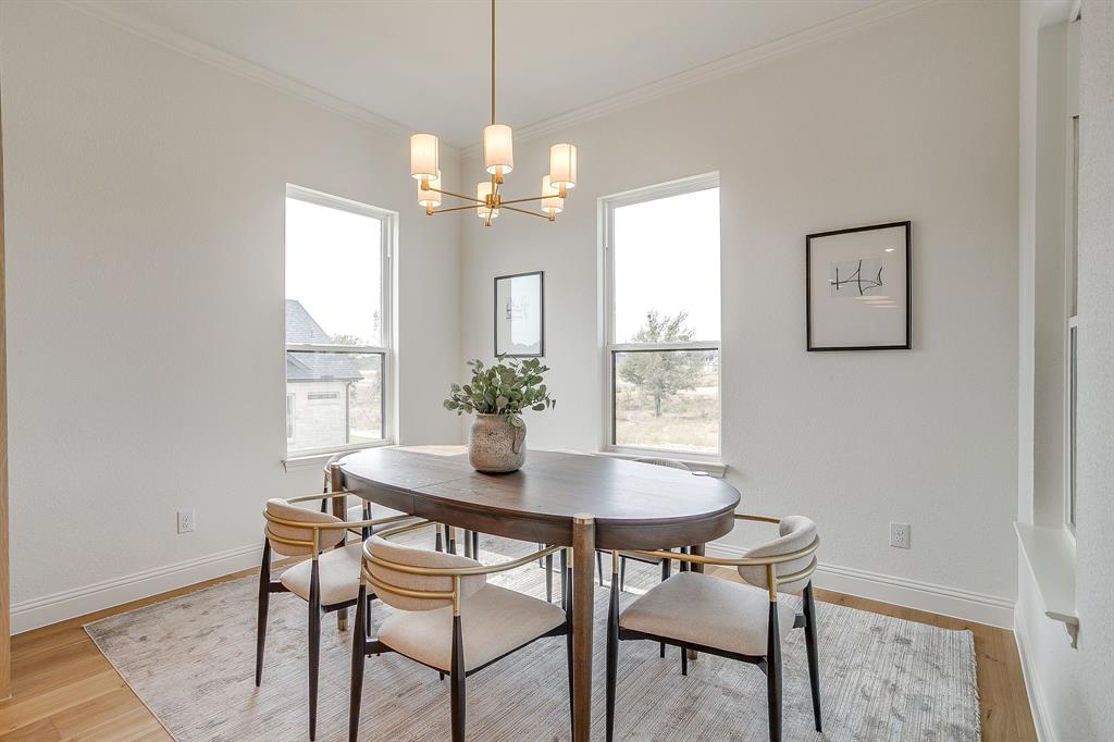 320 Slimp Bluff Azle, TX 76020 - Photo 18 of 37 a view of a dining room with furniture window and wooden floor