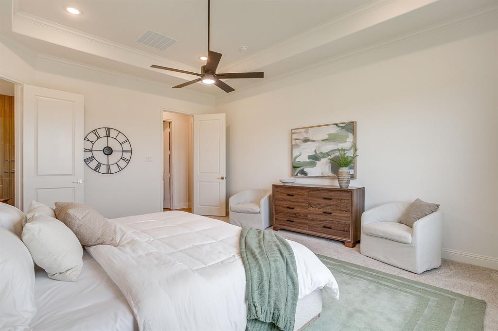 320 Slimp Bluff Azle, TX 76020 - Photo 22 of 37 a bedroom with a bed and a chandelier