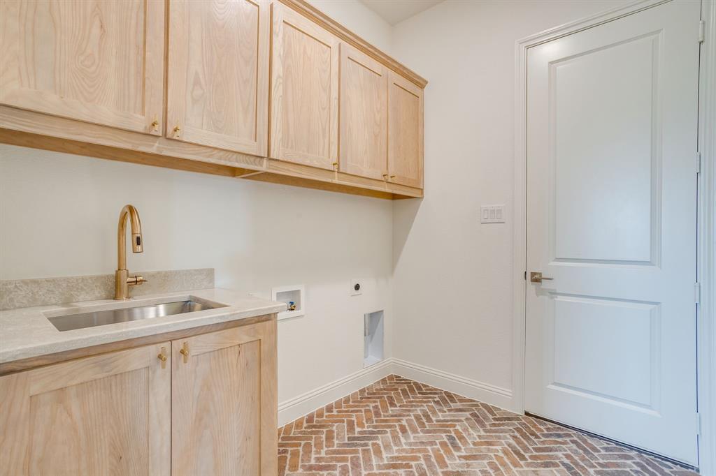 320 Slimp Bluff Azle, TX 76020 - Photo 33 of 37 a kitchen with stainless steel appliances granite countertop a sink and dishwasher with white cabinets