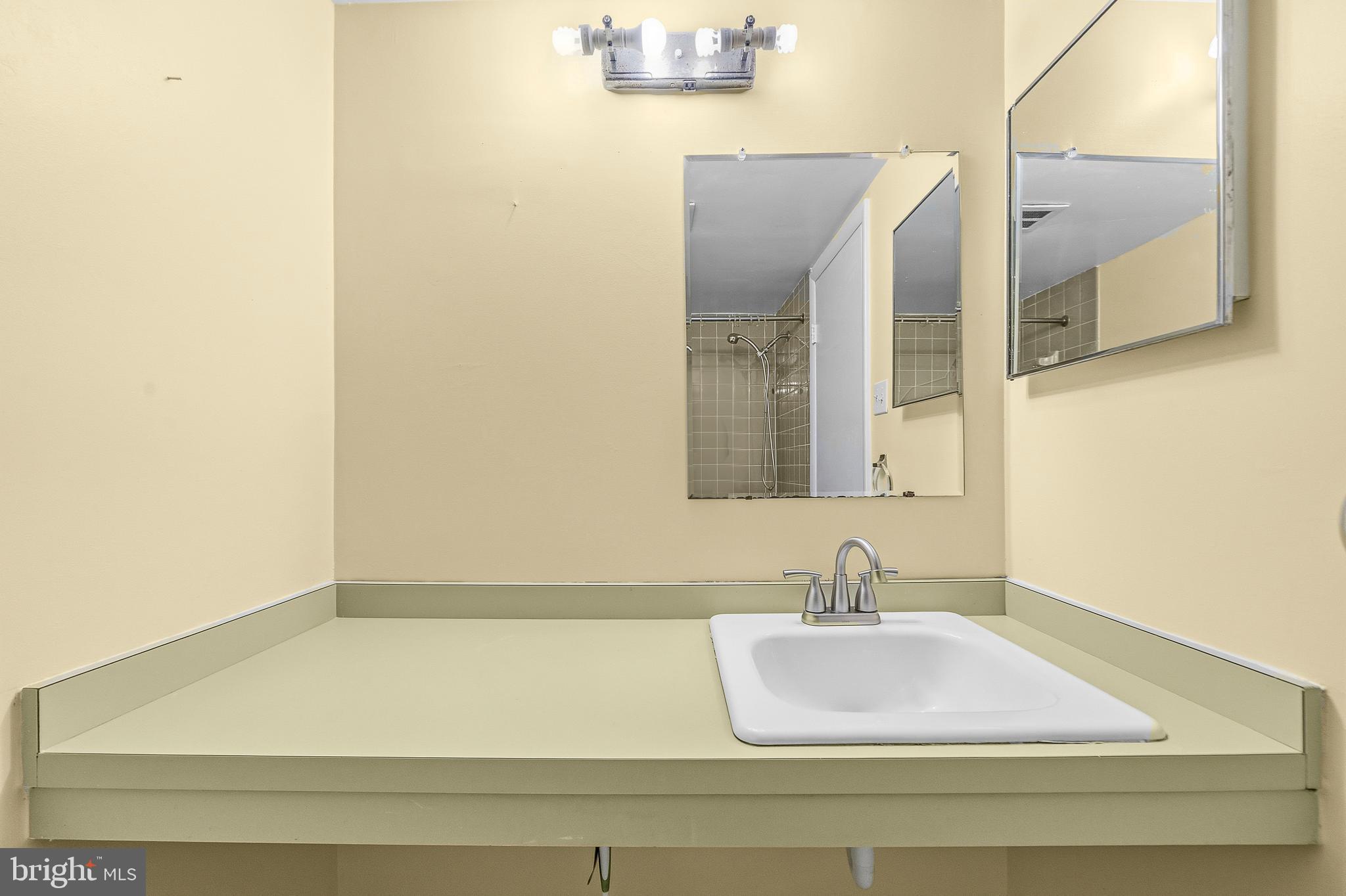 2305 Greenery Lane, Unit T23 Silver Spring, MD 20906 - Photo 26 of 40 a bathroom with a bathtub and a sink