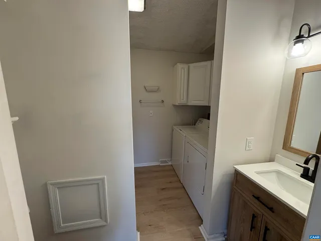 a bathroom with a sink toilet and tub