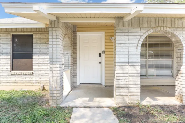 a view of a brick house with a door