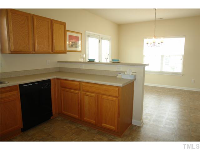 3551 Oneonta Avenue Raleigh, NC 27604 - Photo 6 of 12 a kitchen with sink cabinets and window