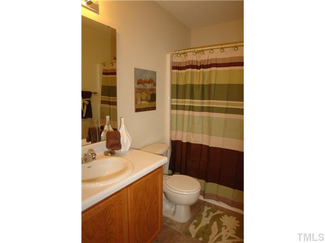 3551 Oneonta Avenue Raleigh, NC 27604 - Photo 10 of 12 a bathroom with a sink toilet and shower