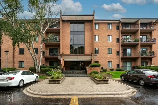 a view of multiple houses with a street