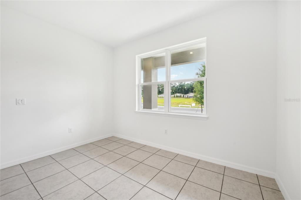 9596 Starling Loop Leesburg, FL 34788 - Photo 20 of 39 a view of an empty room with window