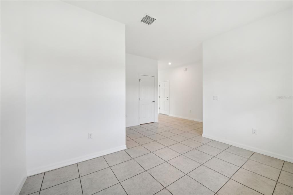 9596 Starling Loop Leesburg, FL 34788 - Photo 21 of 39 a view of an empty room