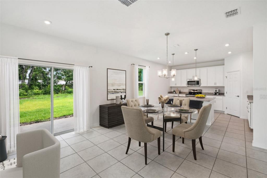9596 Starling Loop Leesburg, FL 34788 - Photo 4 of 39 a view of a dining room with furniture window and outside view