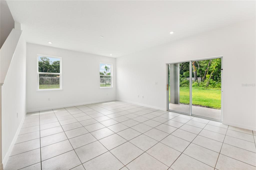 9596 Starling Loop Leesburg, FL 34788 - Photo 6 of 39 a view of an empty room with a window