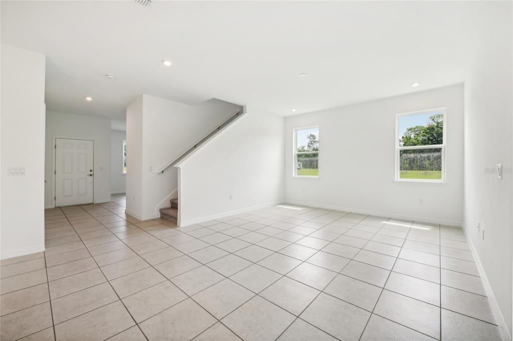9596 Starling Loop Leesburg, FL 34788 - Photo 7 of 39 an empty room with windows and closet