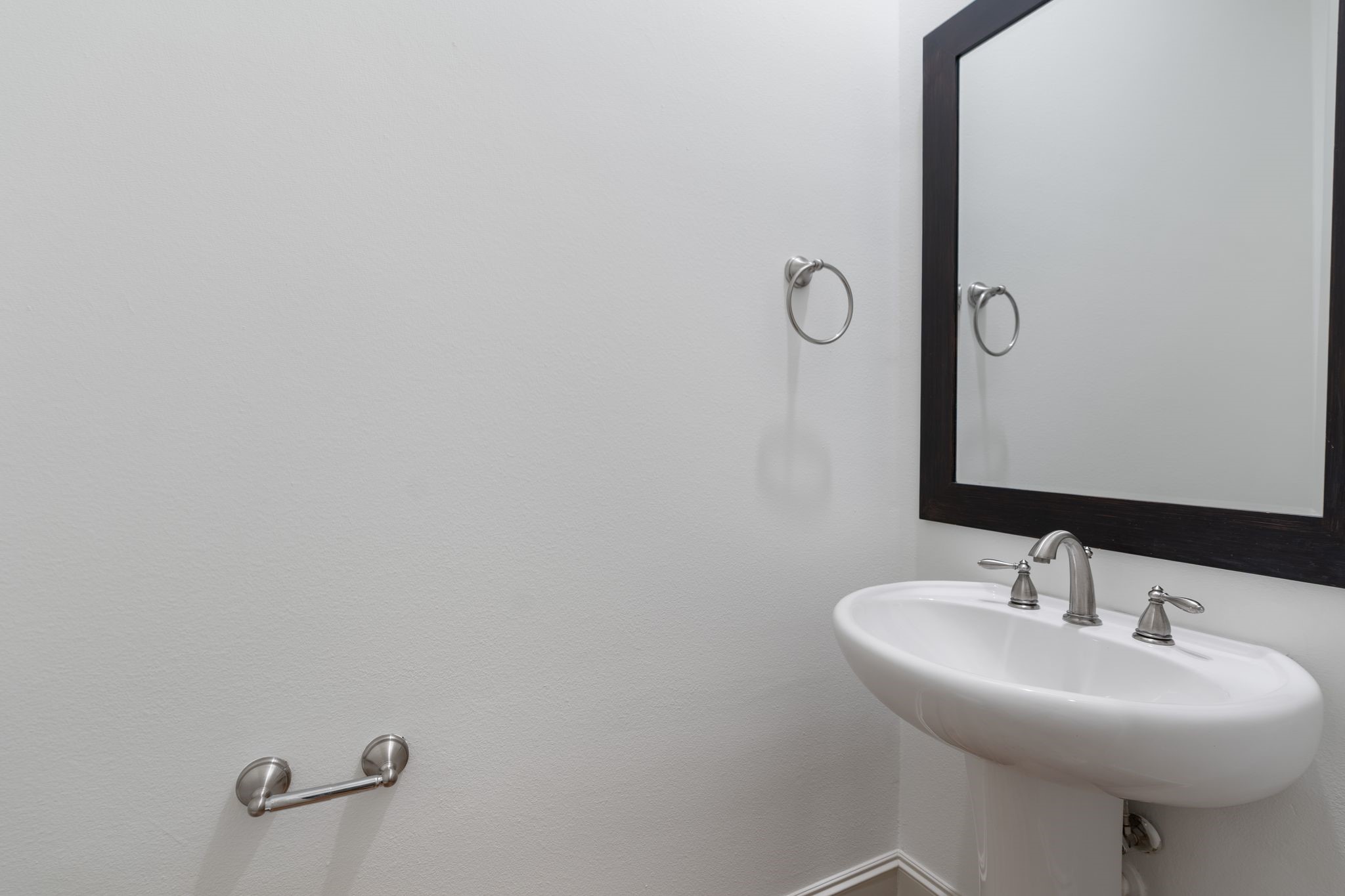 1103 Summer Street Houston, TX 77007 - Photo 12 of 30 A half bathroom is conveniently located on the first level for guest use.