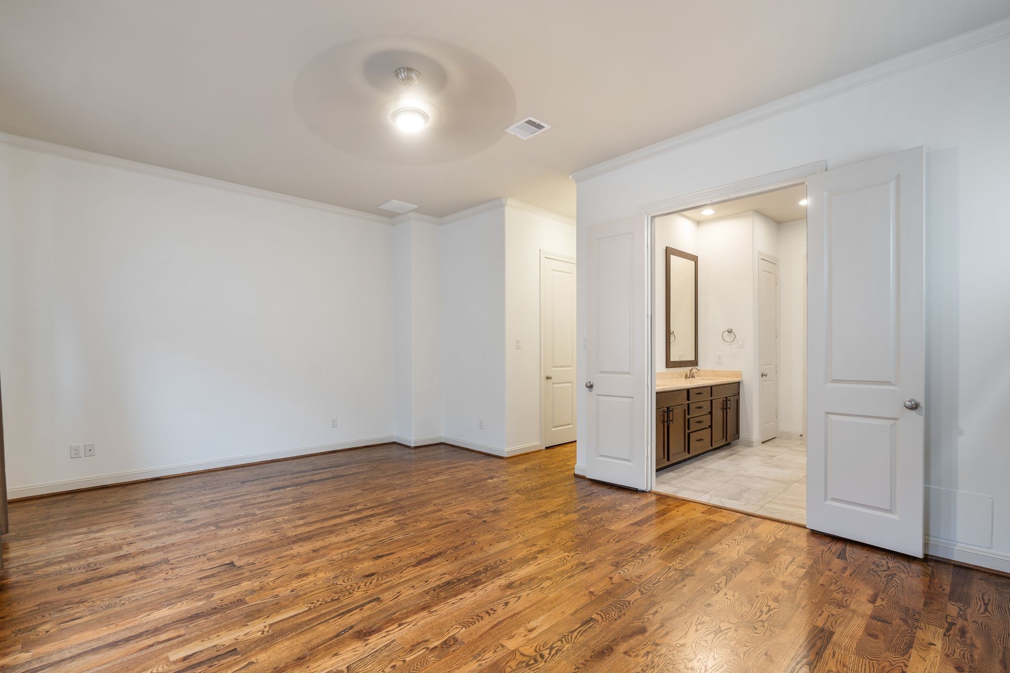1103 Summer Street Houston, TX 77007 - Photo 15 of 30 Double doors create a grand entrance into a private ensuite bathroom.