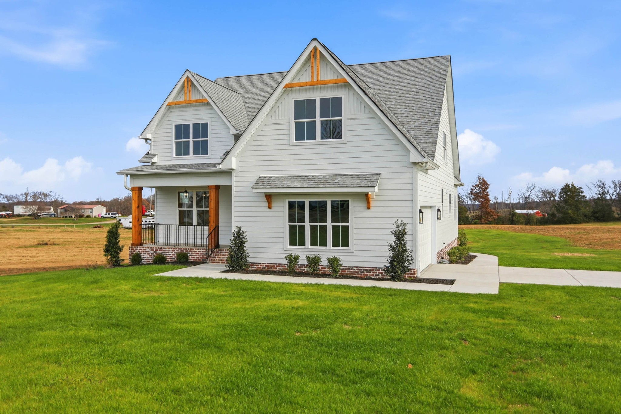 a front view of house with yard and green space