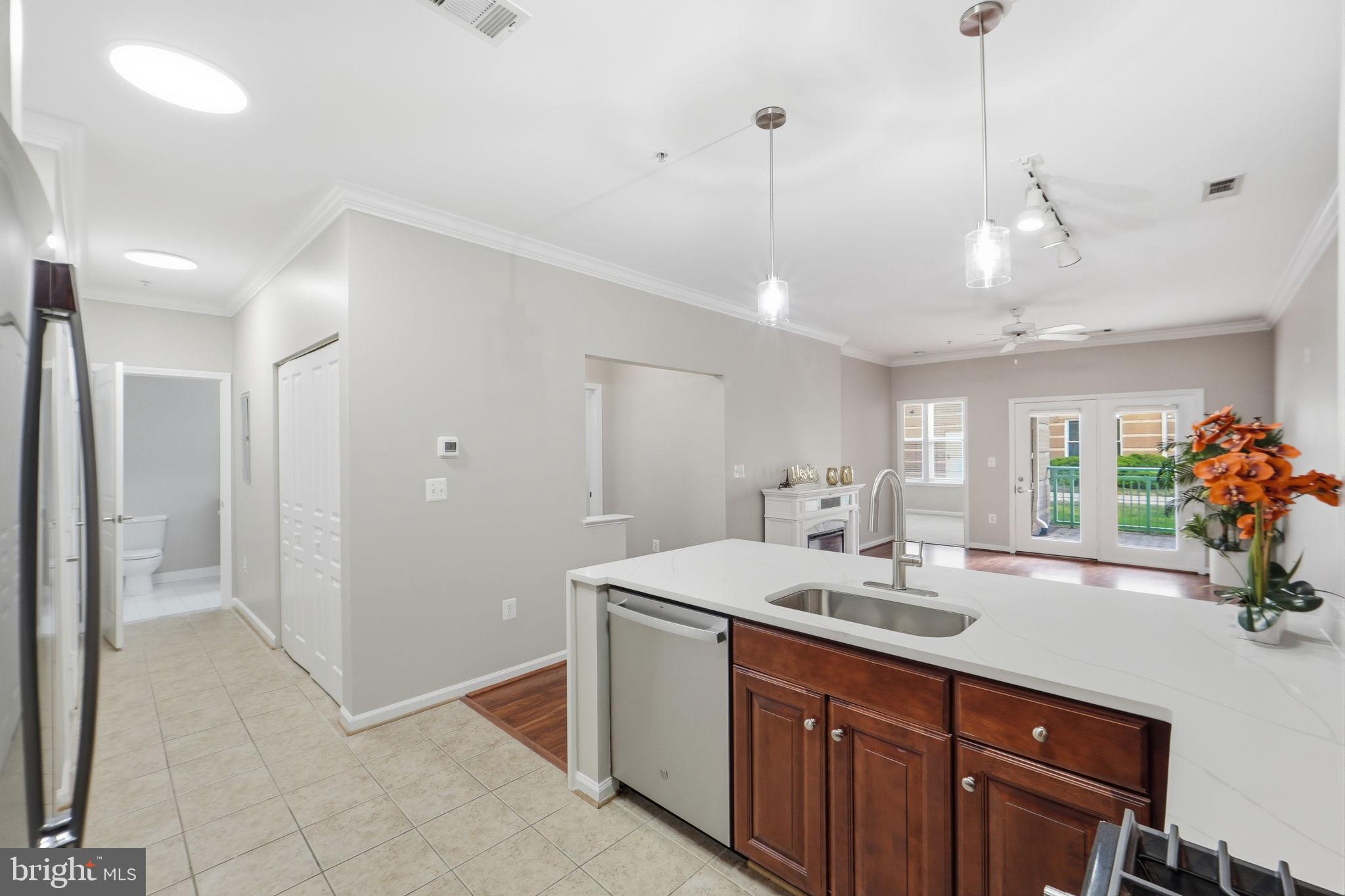 12001 Market Street, Unit 140 Reston, VA 20190 - Photo 8 of 48 Modern kitchen with open layout charm.