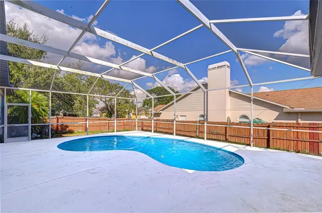 a view of a swimming pool with a patio