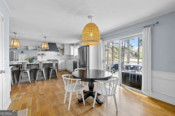 a bathroom with a shower sink and mirror
