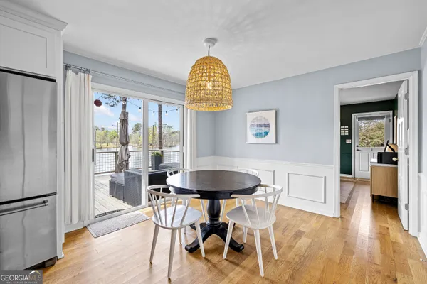 a view of an empty room with window and a living room
