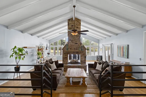 a view of a bedroom with a bed and a window