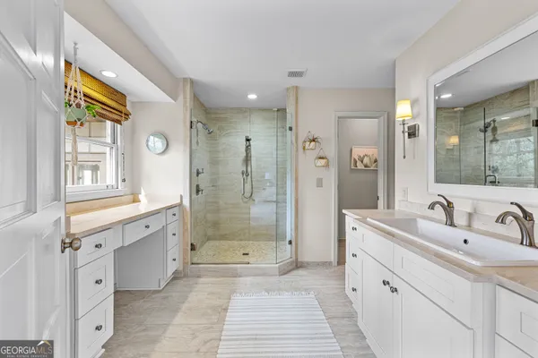 a utility room with sink dryer and washer
