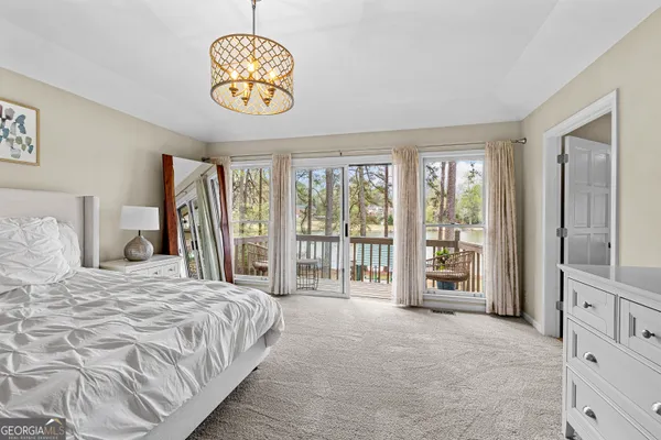 a front view of a house with swimming pool and porch