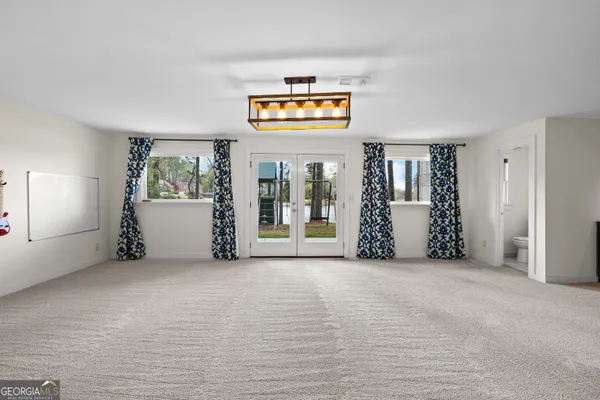 a view of a lake with couches and city view