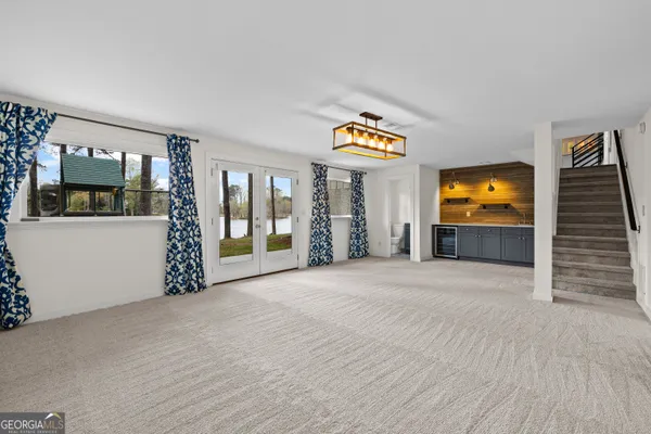 a view of a house with swimming pool and sitting area
