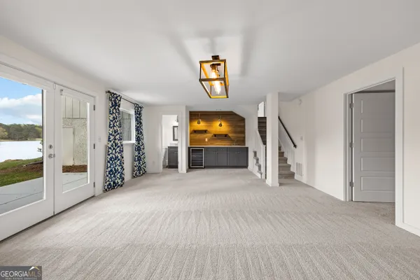 a view of a house with swimming pool and sitting area