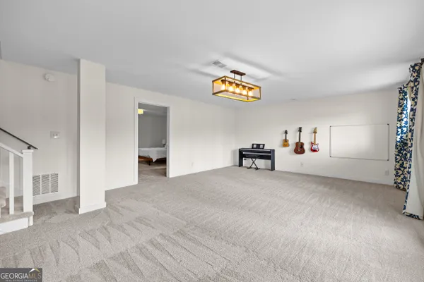 a front view of a house with yard and tree s