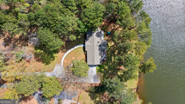 a dining room with furniture and a chandelier