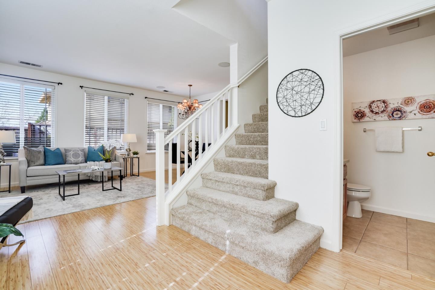 779 Canoas Creek Circle San Jose, CA 95136 - Photo 12 of 58 a living room with furniture and a clock