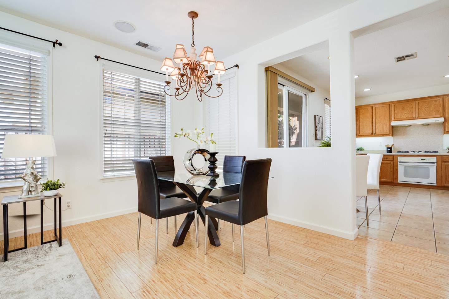 779 Canoas Creek Circle San Jose, CA 95136 - Photo 16 of 58 a view of a dining room with furniture and wooden floor