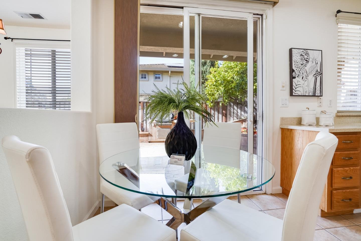 779 Canoas Creek Circle San Jose, CA 95136 - Photo 19 of 58 a view of a dining room with furniture window and flowerpot
