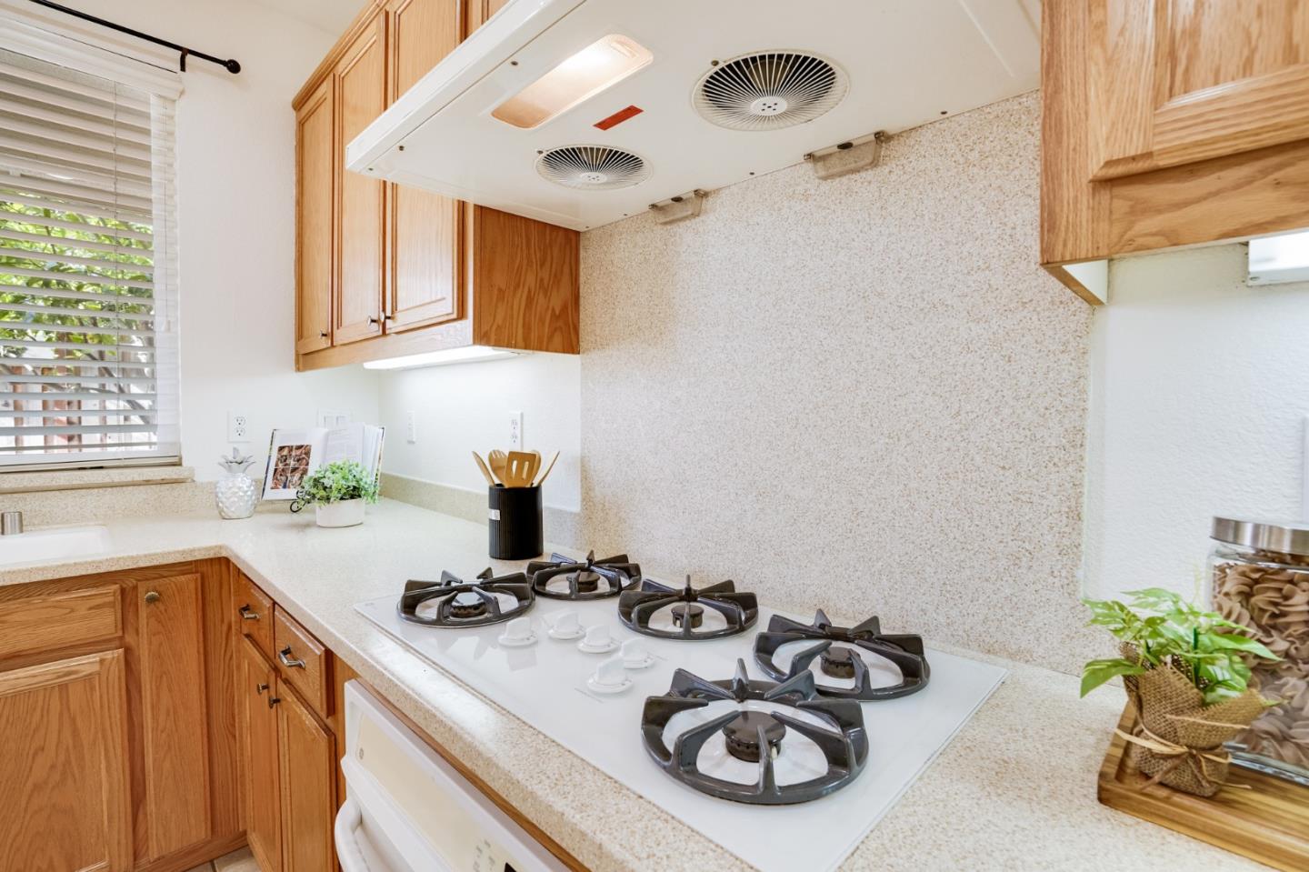 779 Canoas Creek Circle San Jose, CA 95136 - Photo 24 of 58 a kitchen with a sink a stove and cabinets