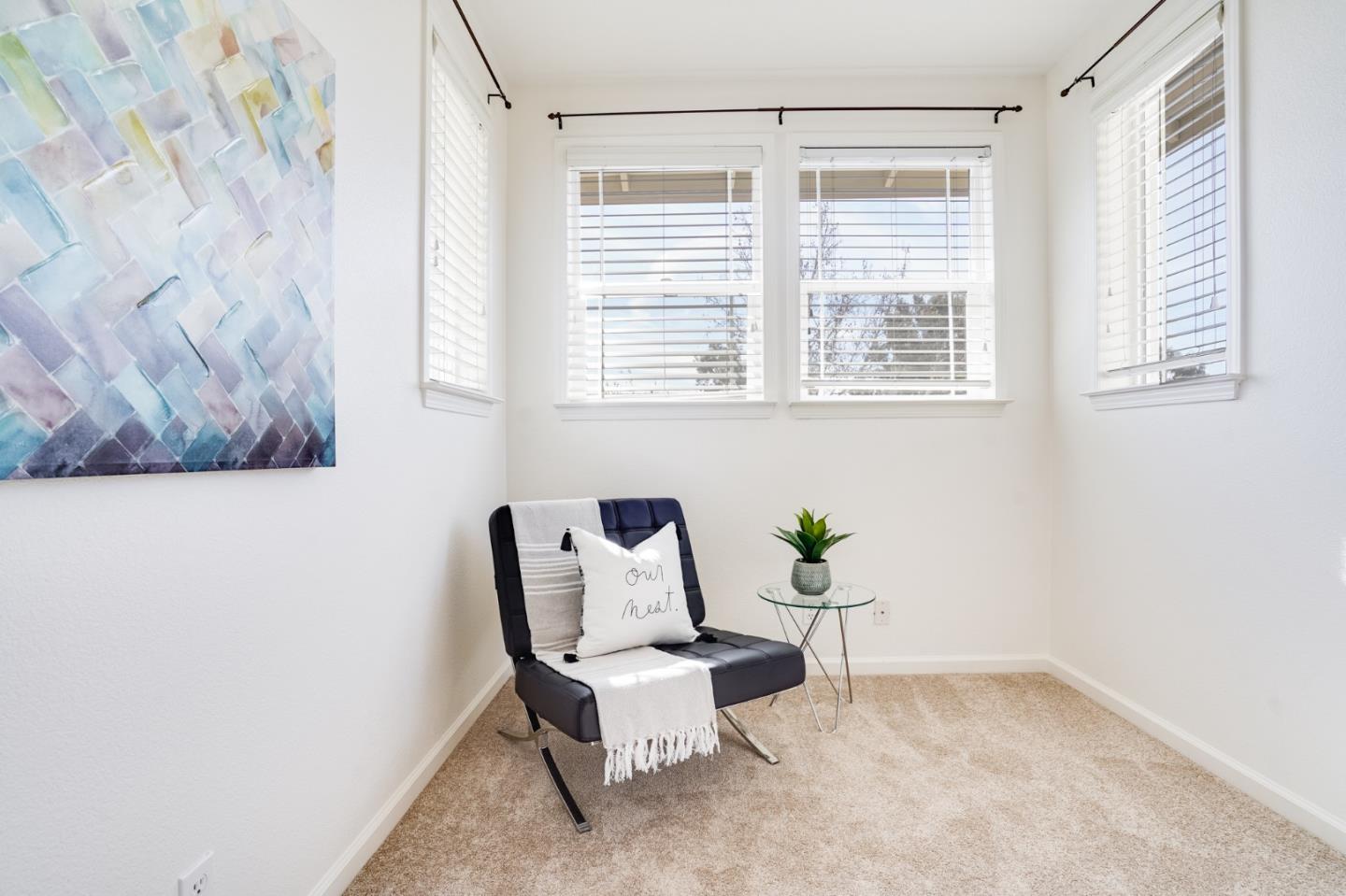 779 Canoas Creek Circle San Jose, CA 95136 - Photo 27 of 58 a white chair sitting in a room next to a window