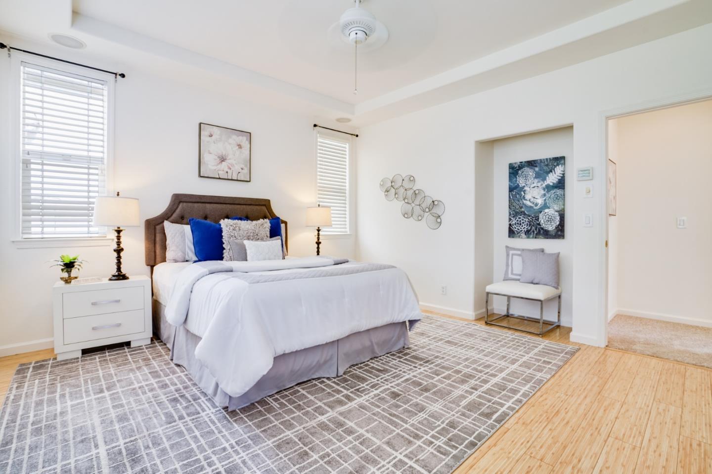 779 Canoas Creek Circle San Jose, CA 95136 - Photo 31 of 58 a bedroom with a bed and a painting on the wall