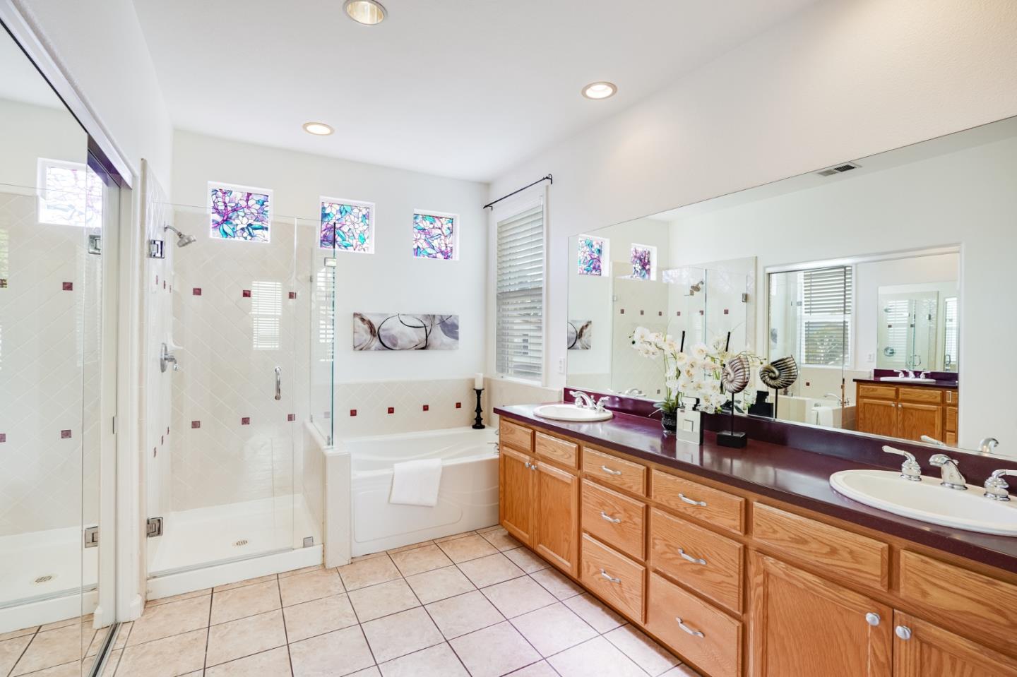779 Canoas Creek Circle San Jose, CA 95136 - Photo 34 of 58 a spacious bathroom with a sink mirror and shower