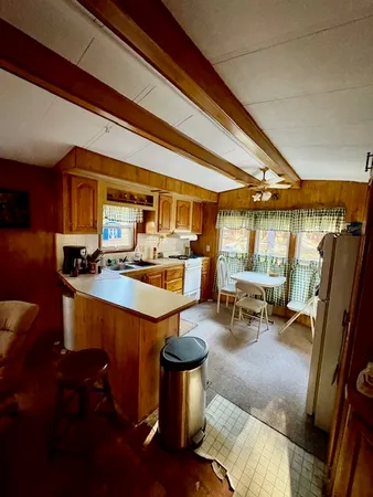 a kitchen with stainless steel appliances granite countertop a sink and cabinets