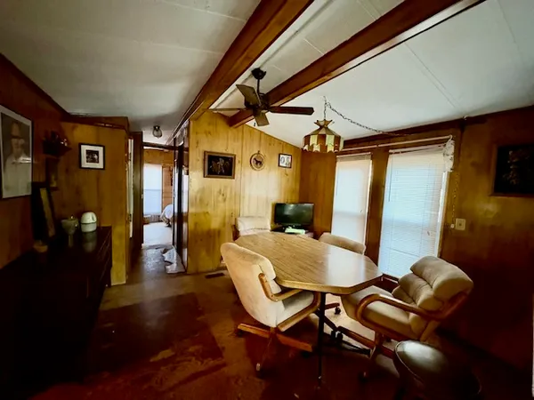 a bedroom with furniture and a chandelier