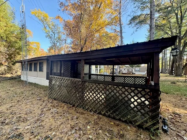 a front view of a house with a large window
