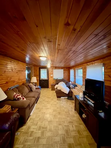 a bed room with a bed and a television