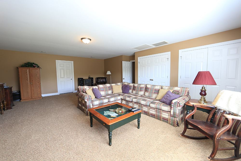 214 Steve Ridge Willow Spring, NC 27592 - Photo 23 of 29 Huge bonus room with many furniture placement options - great closets - and access to walk in attic space with over 200 sq feet of storage. Bonus Room