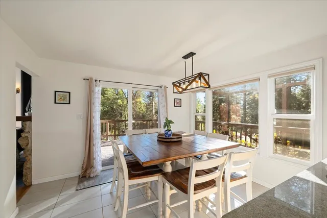 a bedroom with furniture and a large window